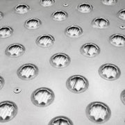 A closeup of the punch plate of the HD Ramps 48" x 36" Punch Plate Shipping Container Ramp