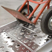 HD Ramps 10' x 26" Plate End Aluminum Walk Ramp is in use with a hand truck