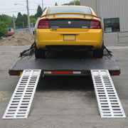 HD Ramps 16' L x 18" W Aluminum Hook End Car Trailer Ramps with 5,000 lb. Per Axle Capacity is attached to the trailer