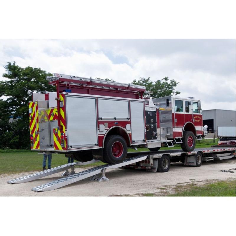 HD Ramps 16’ L x 20" W 2 Bunk Load Leveler / 4 Ramp System for 26" H Step Deck Trailers ramp in use by a firetruck
