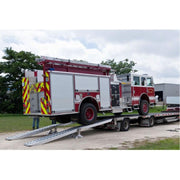 HD Ramps 16' L x 20" W 4 Bunk Load Leveler / 4 Ramp System for 20" H Step Deck Trailers ramp in use by a firetruck
