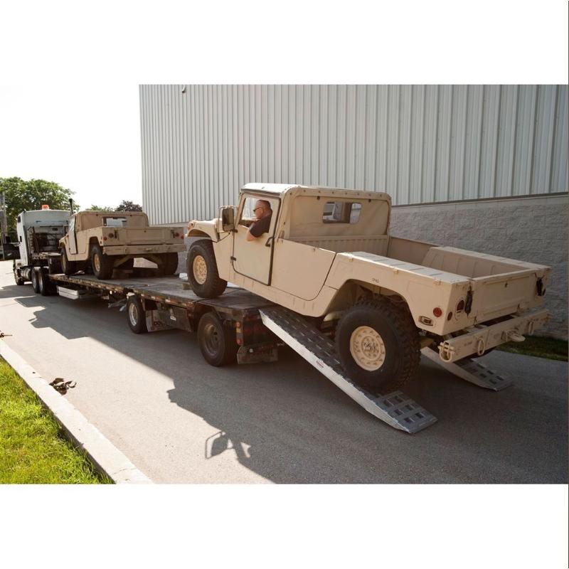 HD Ramps 2 Bunk Load Leveler / 2 Ramp System 8'x20" for 26" H Step Deck Trailers is in use as a ramp