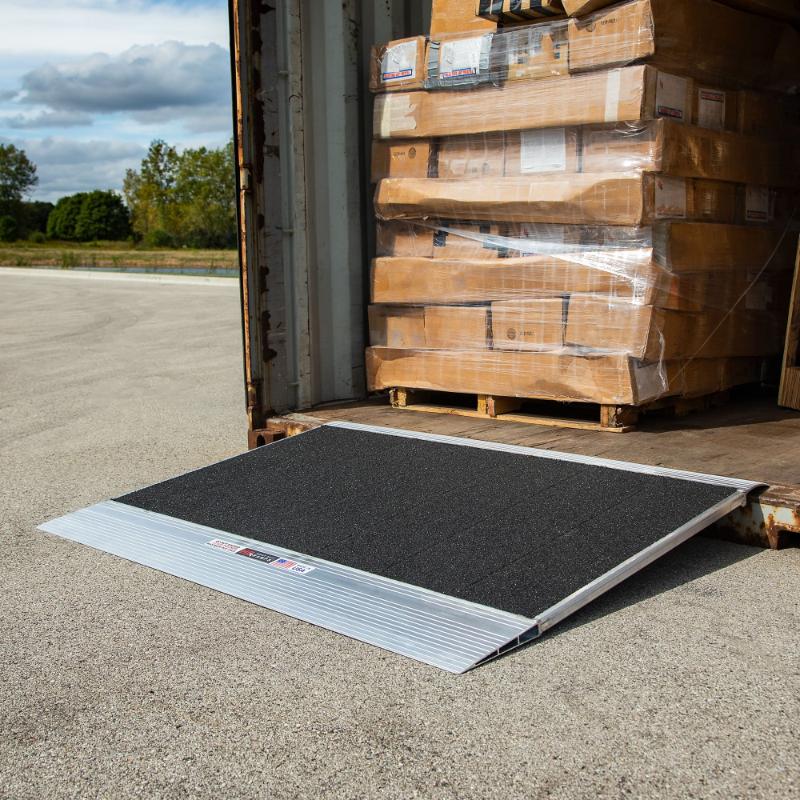 HD Ramps 36"x36" Grit-Coat Shipping Container Ramp is attached to the container