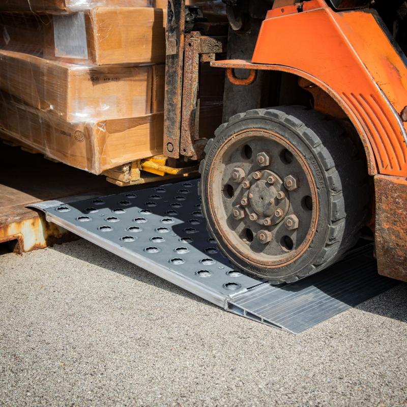 HD Ramps 48" x 36" Punch Plate Shipping Container Ramps 8,000 lb. Capacity is in use by a forklift