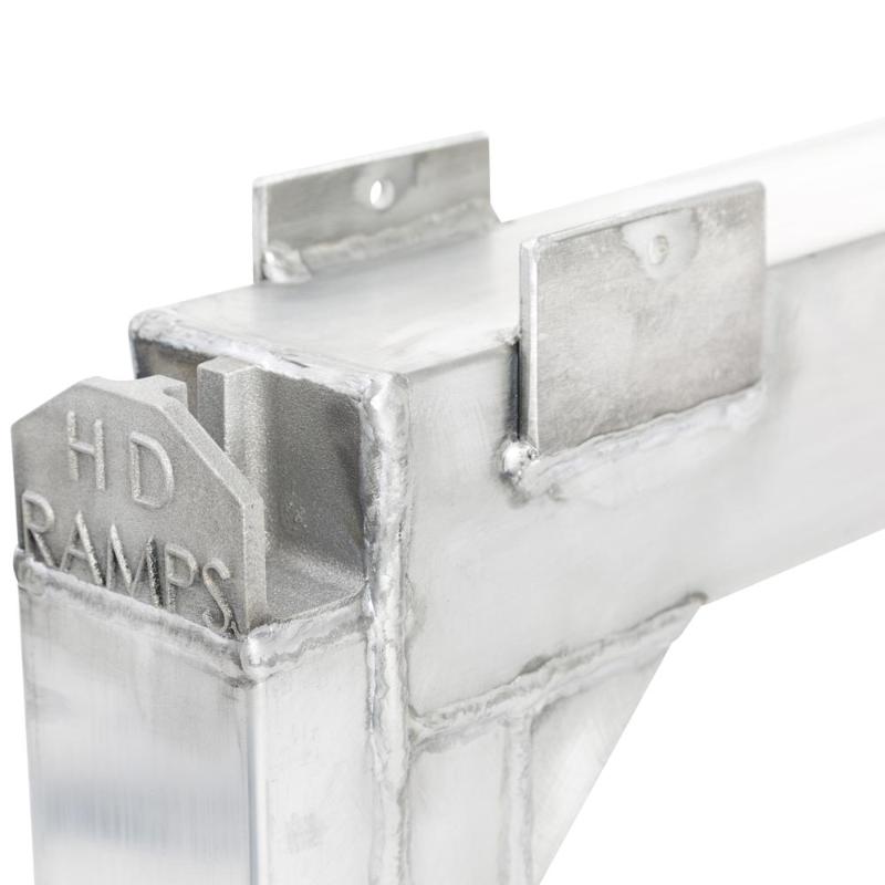 welded brackets of the HD Ramps 5" x 100.875" x 26" Aluminum Load Leveler Bridge for Step Deck Trailers 