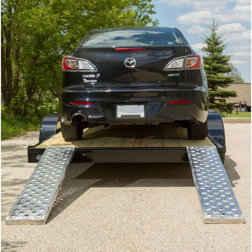 HD Ramps 5' x 12" EZ Traction Hook & Plate Hybrid Aluminum Car Trailer Ramps 3000 lbs Capacity is attached to the trailer