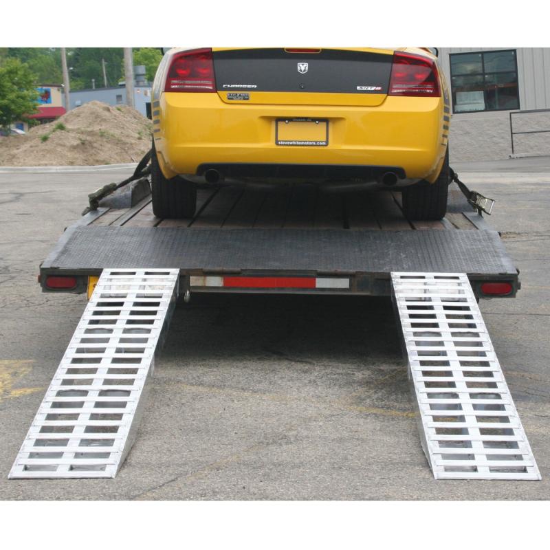 HD Ramps 7'10" Aluminum Plate End Car Trailer Ramps 5,000 lb. Capacity is attached to the trailer