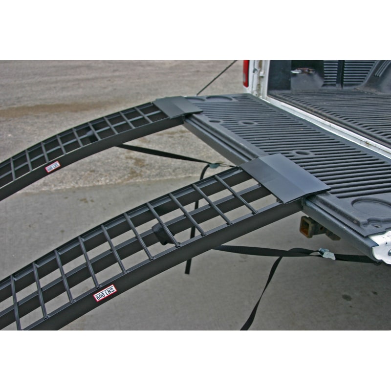 Black Widow Aluminum Dual Runner Folding ATV Ramps mounted on a pickup truck 
