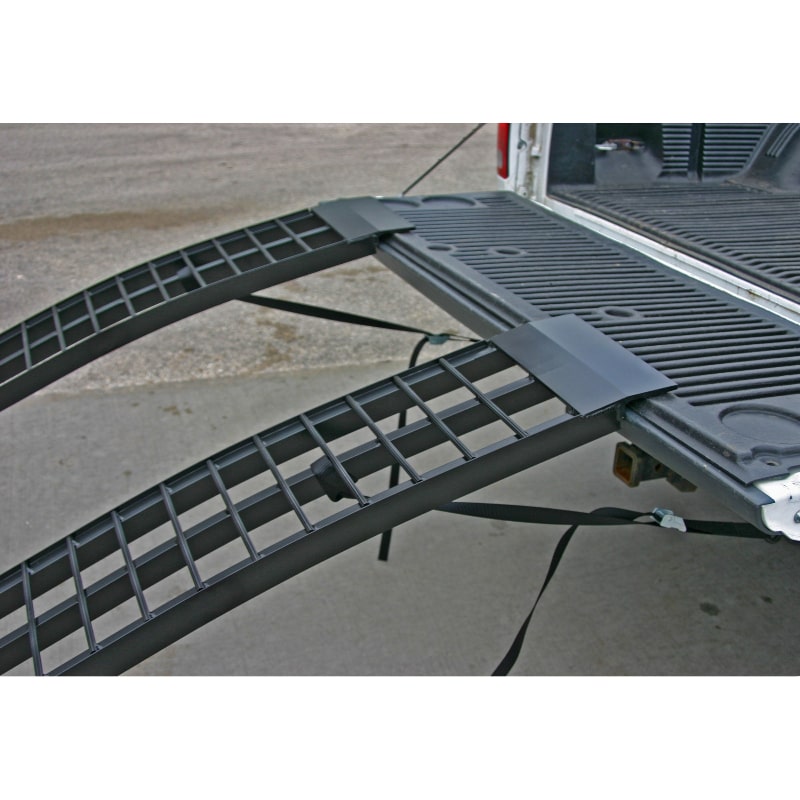 Black Widow Aluminum Dual Runner Folding ATV Ramps mounted on the back of a pickup truck