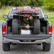 Black Widow Aluminum Extra-Wide Folding ATV Ramp folded and placed on the back of a truck
