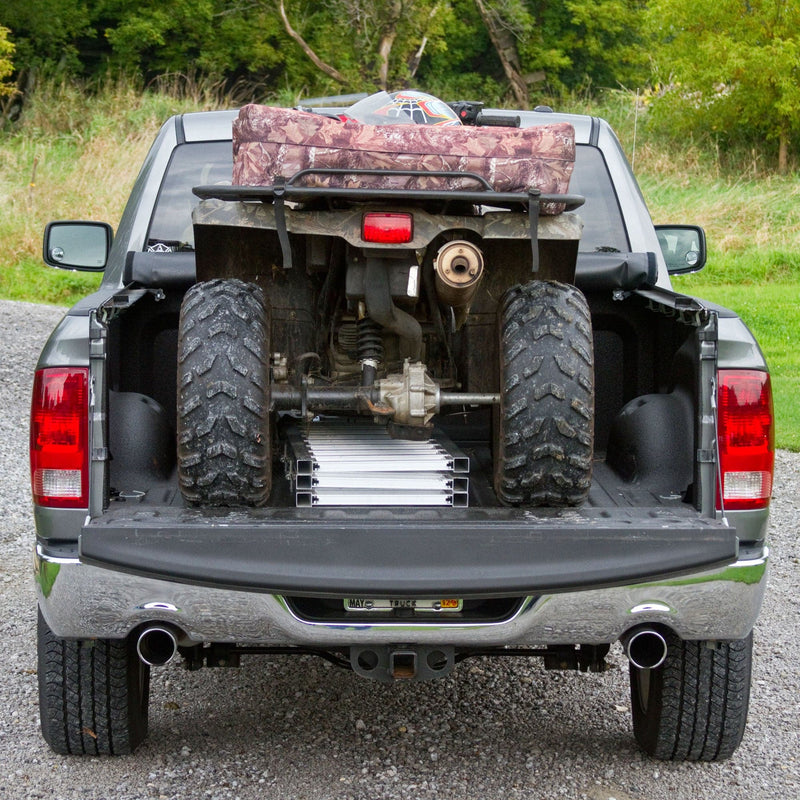 Black Widow Aluminum Extra-Wide Folding ATV Ramp folded and placed on the back of a truck
