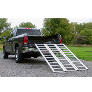 Black Widow Aluminum Extra-Wide Folding ATV Ramp mounted on the back of a truck