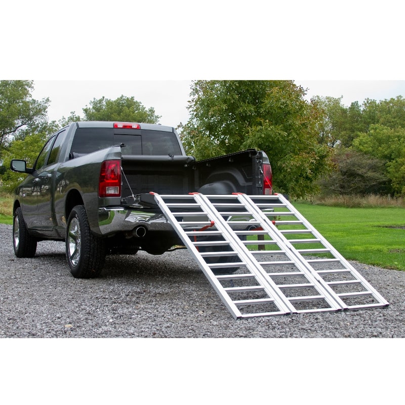 Black Widow Aluminum Extra-Wide Folding ATV Ramp mounted on the back of a truck