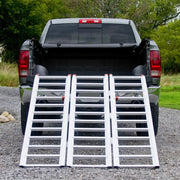 Black Widow Aluminum Extra-Wide Folding ATV Ramp mounted on the back of a truck rear view
