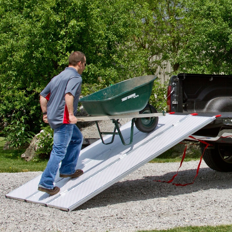 Black Widow Aluminum Extra-Wide Punch Plate Folding ATV Ramp in use
