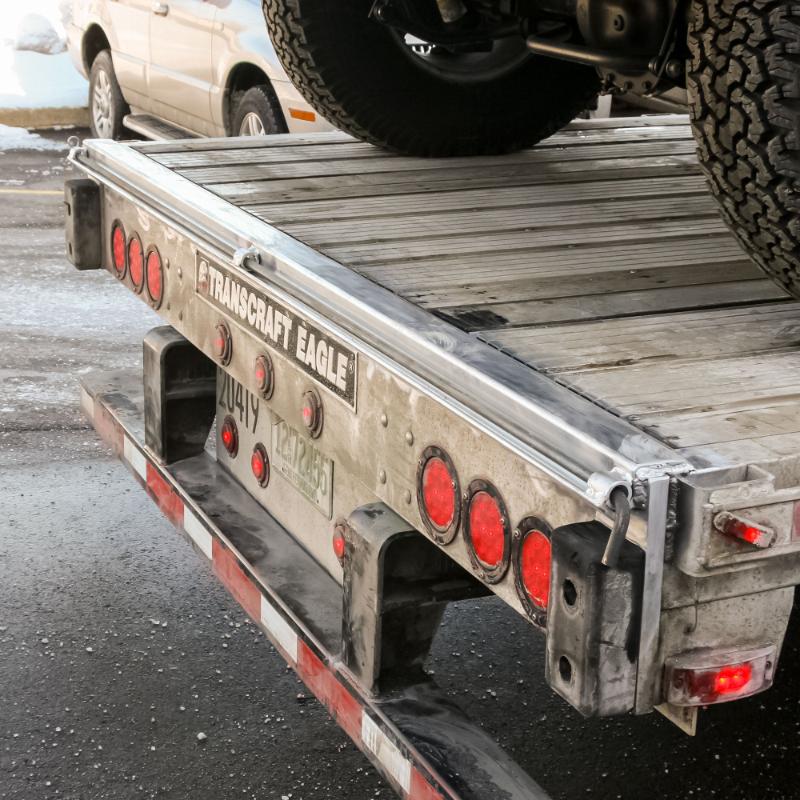 HD Ramps Aluminum Skid Seat Attaching Bracket attached to the trailer