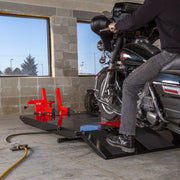 motorcycle being placed on the Black Widow ProLift Extra-Wide Pneumatic Motorcycle Lift Table