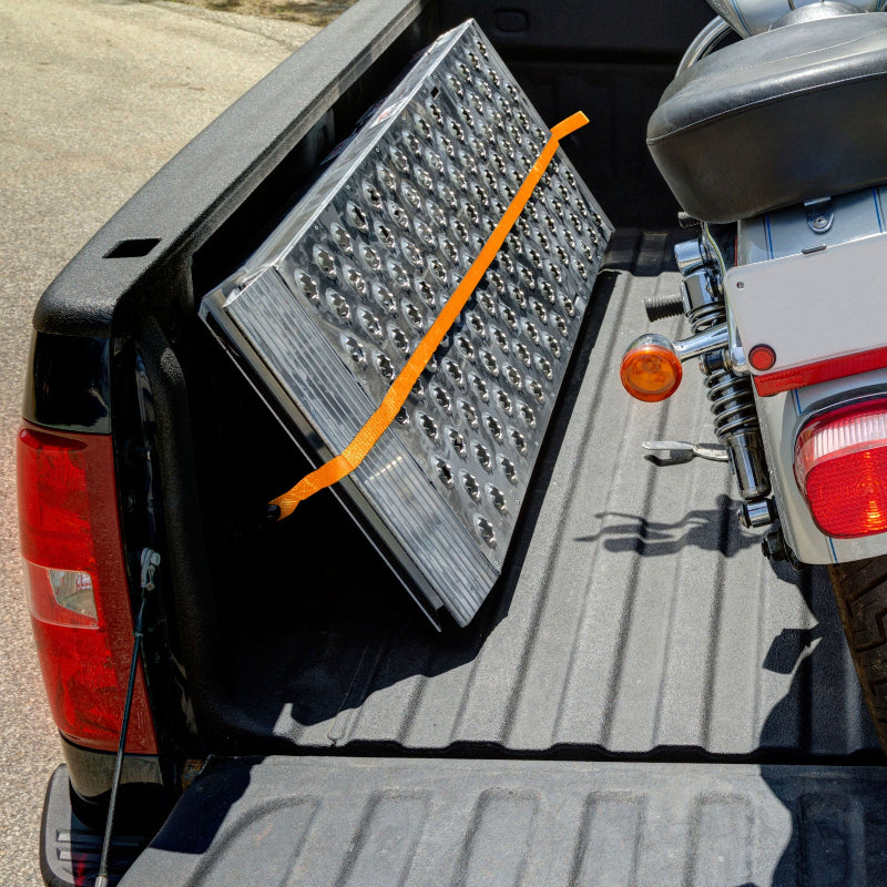 Black Widow Big Boy EZ Rizer Aluminum Folding Single Runner Motorcycle Ramp folded placed resting on a pickup truck
