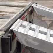 HD Ramps Hook-End Heavy Equipment Ramps 12'x16" with 12,000 lbs Capacity is hooked to the trailer