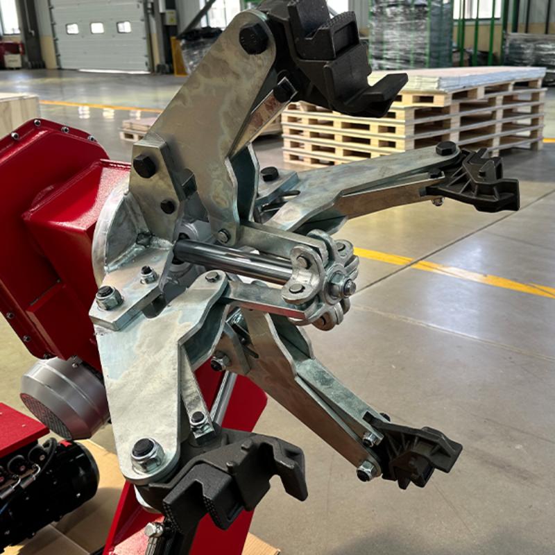 open jaw clamp of the KATOOL KT-T160 Heavy Duty Truck Tire Changer Machine Electro-Hydraulic with Multifix System and 62" Max Wheel Capacity
