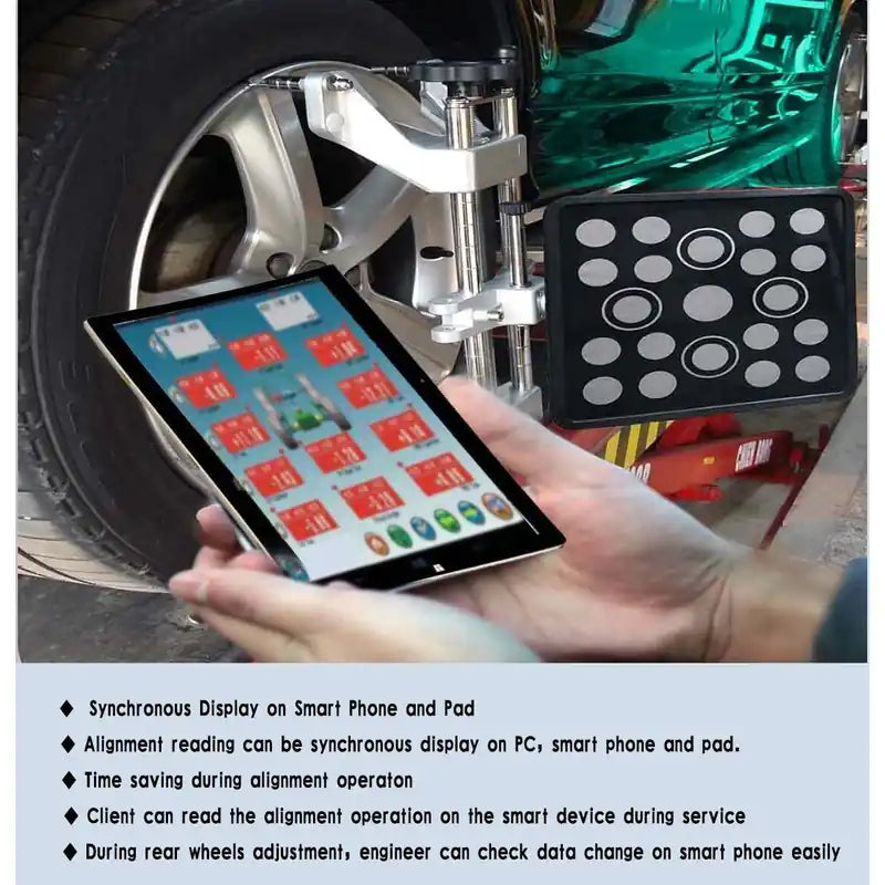 Technician reading Katool AV9 Pro alignment data on a tablet at the wheel