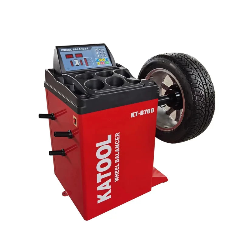 Katool KT-B700 wheel balancer with a wheel on the shaft