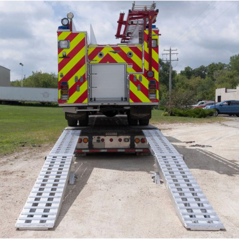 HD Ramps Modular Step Deck Trailer Ramp System attached on a trailer with firetruck placed on it
