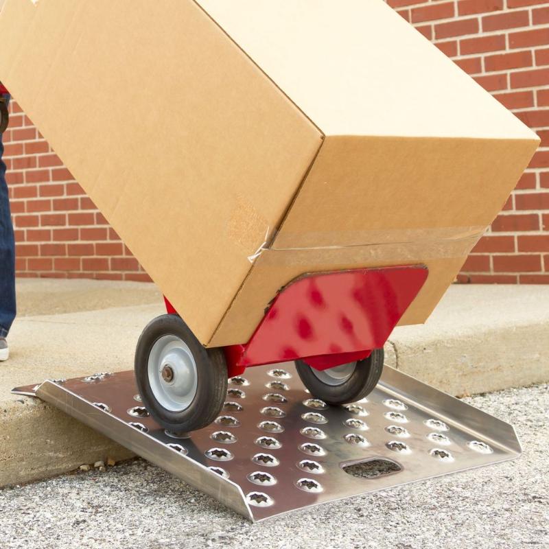 Guardian 36 inch aluminum curb ramp in use with a hand truck providing stable access over a curb.
