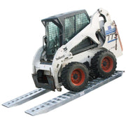 HD Ramps heavy equipment pin-on ramps safely load a Bobcat skid steer onto a trailer.