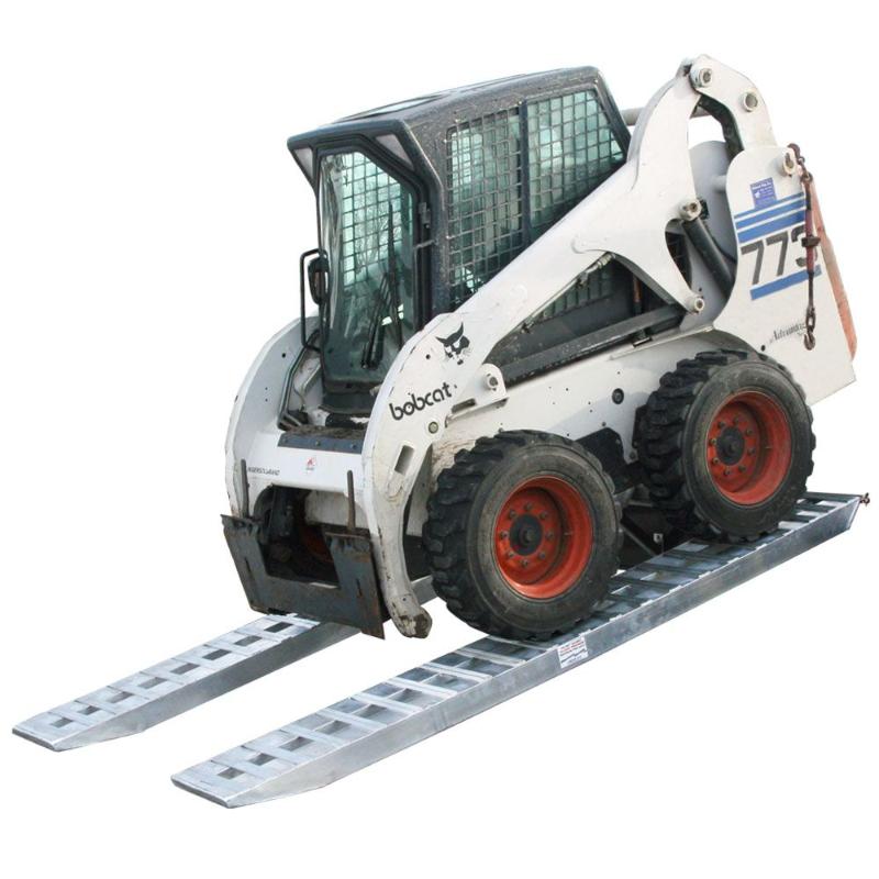 HD Ramps heavy equipment pin-on ramps safely load a Bobcat skid steer onto a trailer.