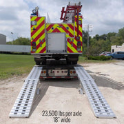HD Ramps modular system back view shows a fire truck being loaded onto a step deck.