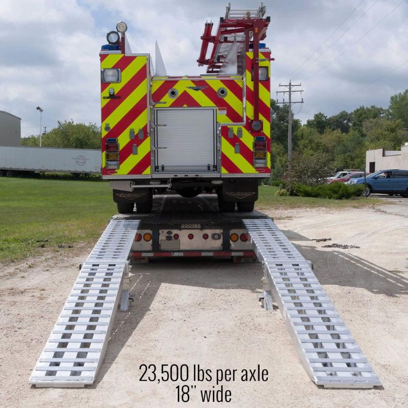 HD Ramps modular system back view shows a fire truck being loaded onto a step deck.