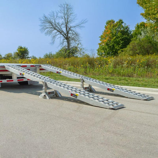 The HD Ramps Master Kit (23-20-192-02-02-MLL-2-KIT) is attached to a 20-inch step deck trailer for use.