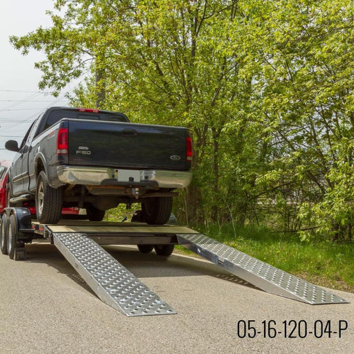 HD Ramps EZ Traction aluminum car ramps are attached to a trailer carrying a pickup truck load.