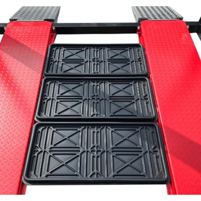 Four post storage lift from Katool showing the oil pan positioned on the platform for vehicle maintenance and service.