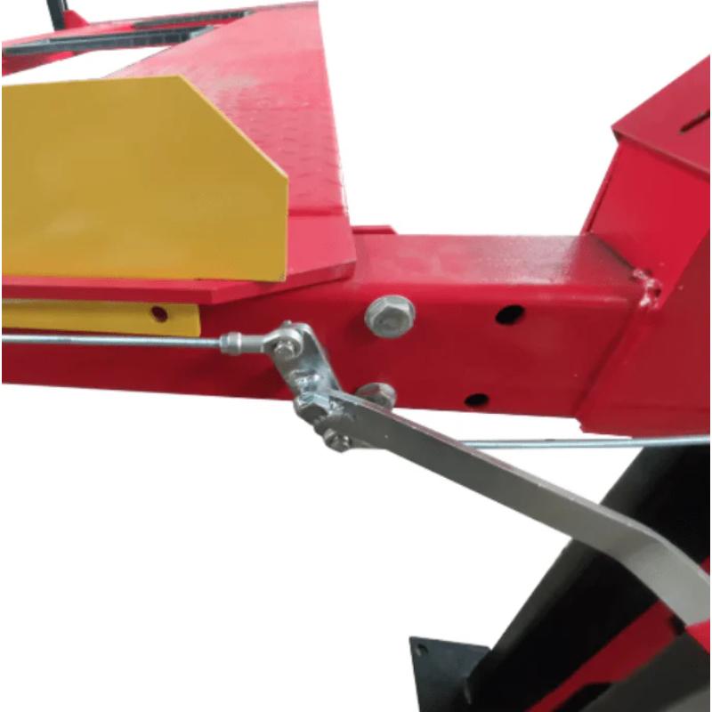 Four post storage lift from Katool showing the edge stopper on the platform that prevents vehicles from rolling off.