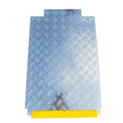 Four post storage lift from Katool showing the detached diamond-plate ramp section for vehicle drive-on access.