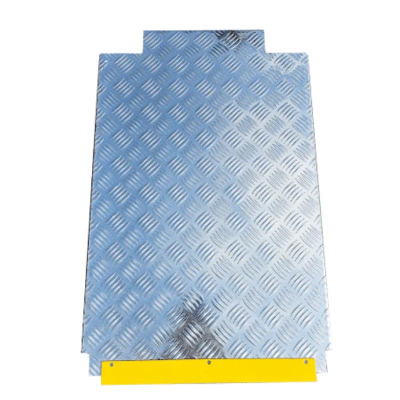 Four post storage lift from Katool showing the detached diamond-plate ramp section for vehicle drive-on access.