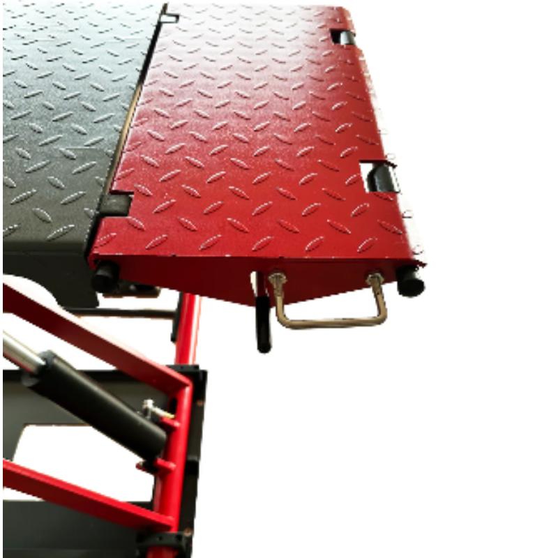 Katool mid-rise scissor lift drive-on ramp providing stable vehicle loading for professional automotive service work.
