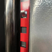 Overhead two-post car lift from KATOOL showing the height adjustment plate with square slots and locking wedge mechanism.