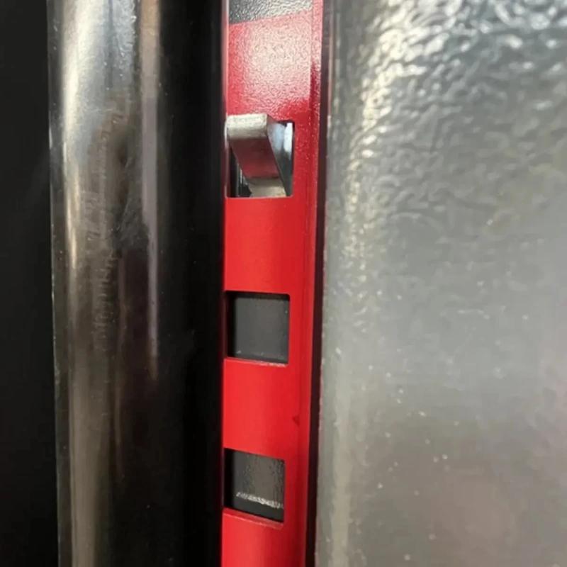 Overhead two-post car lift from KATOOL showing the height adjustment plate with square slots and locking wedge mechanism.