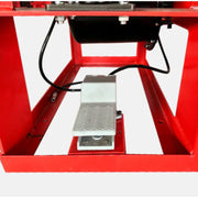 Manual tire changer from Katool showing the foot pedal used to secure and control the wheel during tire service.