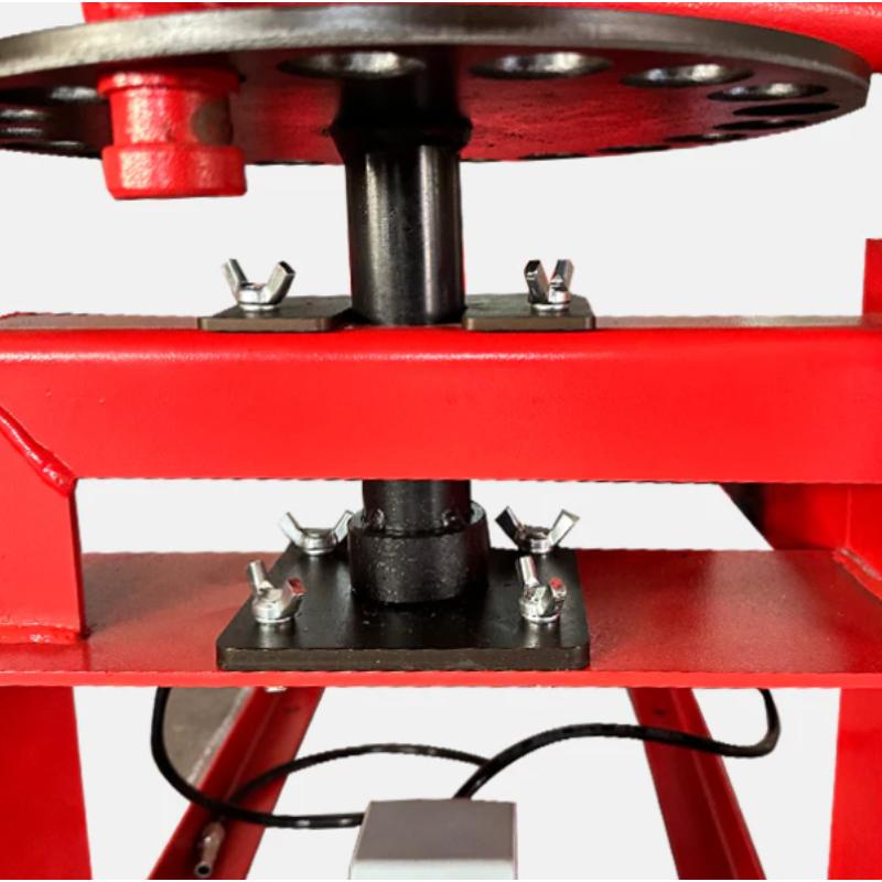 Manual tire changer from Katool showing the central shaft used to position and stabilize the wheel during tire changes.
