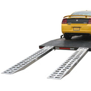 HD Ramps aluminum pin-on car trailer ramps securely attached to a trailer under a loaded vehicle.