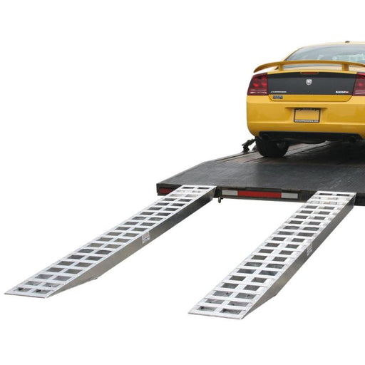 HD Ramps aluminum pin-on car trailer ramps securely attached to a trailer under a loaded vehicle.