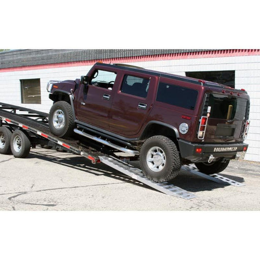 HD Ramps aluminum pin-on car trailer ramps safely support a vehicle actively loading onto the trailer.