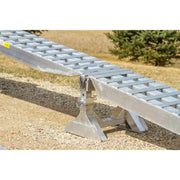 HD Ramps 23,500 lb. loading ramp system is shown pinned to the adjustable ramp support stand for safe use.