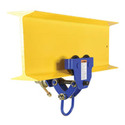Manual trolley from Vestil attached to an I-beam at an angled view showing stable mounting and controlled overhead lifting.